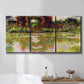 Three-panel canvas wall art featuring arched rose garden walkway, displayed in a bathroom above a bathtub.
