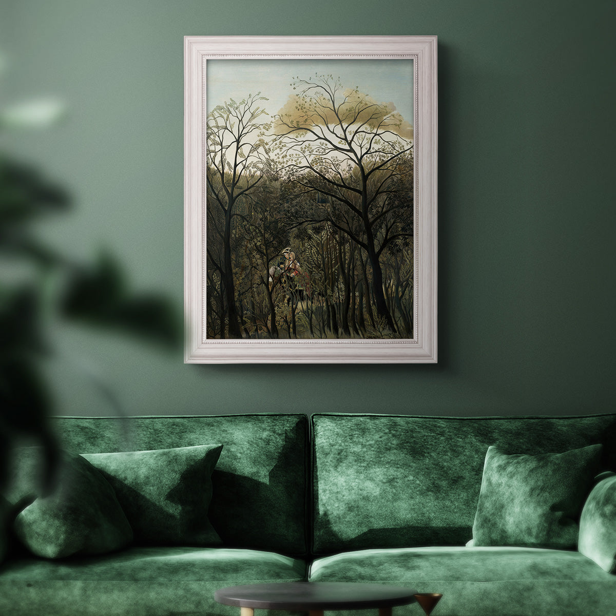Dreamlike forest landscape scene by Henri Rousseau in an ornate weathered white frame displayed in a dark-toned interior setting.