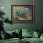 Impressionist lilac flower painting by Vincent van Gogh in an ornate bronzed mahogany wood frame displayed in a dark-toned interior setting.