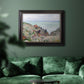 Impressionist coastal watch cabin scene by Claude Monet in an ornate black frame with gilded inner detail displayed in a dark-toned interior setting.
