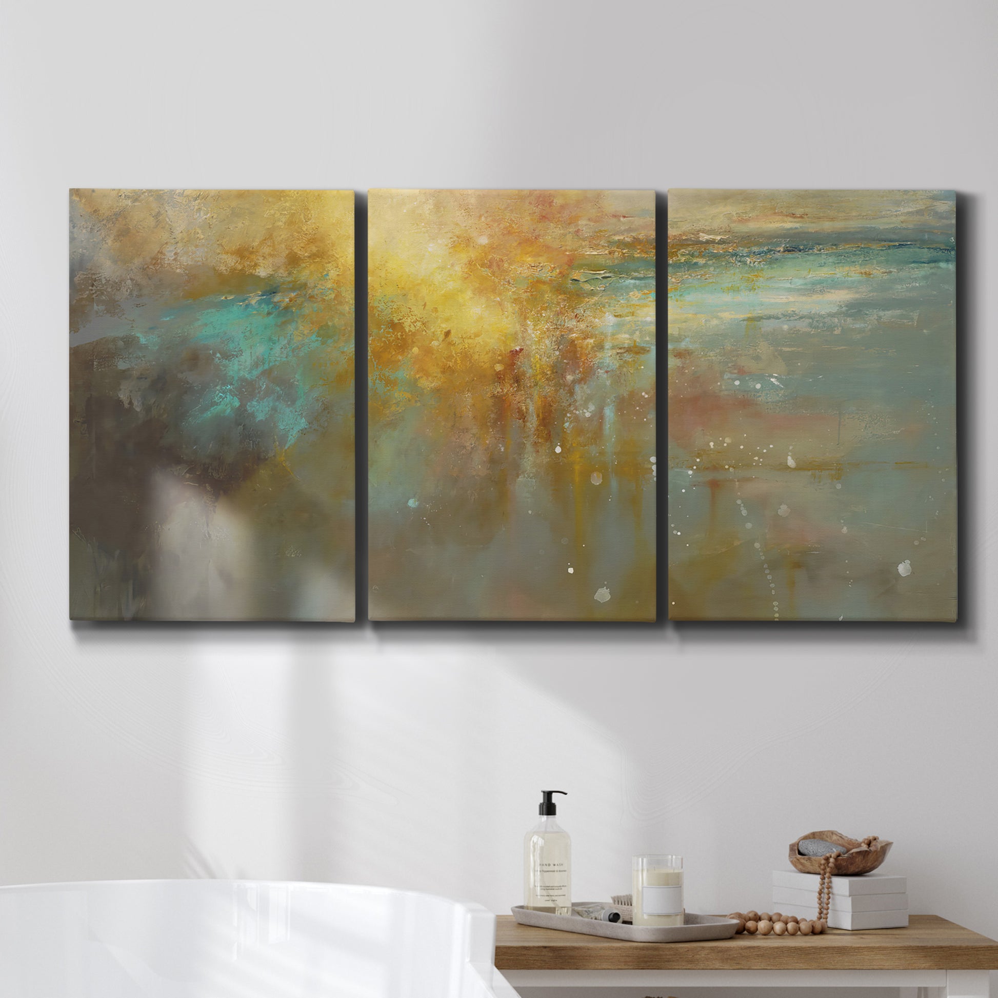 Three-panel canvas wall art featuring muted abstract river inspired tones, displayed in a bathroom above a bathtub.