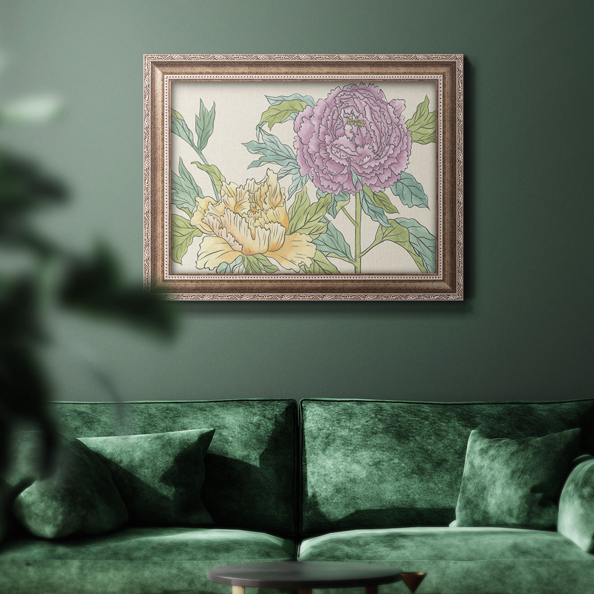 Contemporary peony flower illustration in an ornate traditional silver frame displayed in a dark-toned interior setting.