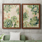 Set of two maple barnwood framed canvas prints depicting a coordinated art pair of dense repeating succulents and small flowers rendered as decorative botanical pattern prints above a sofa in a modern living room.