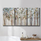 Three-panel canvas wall art featuring bare birch trees in winter forest, displayed in a bathroom above a bathtub.