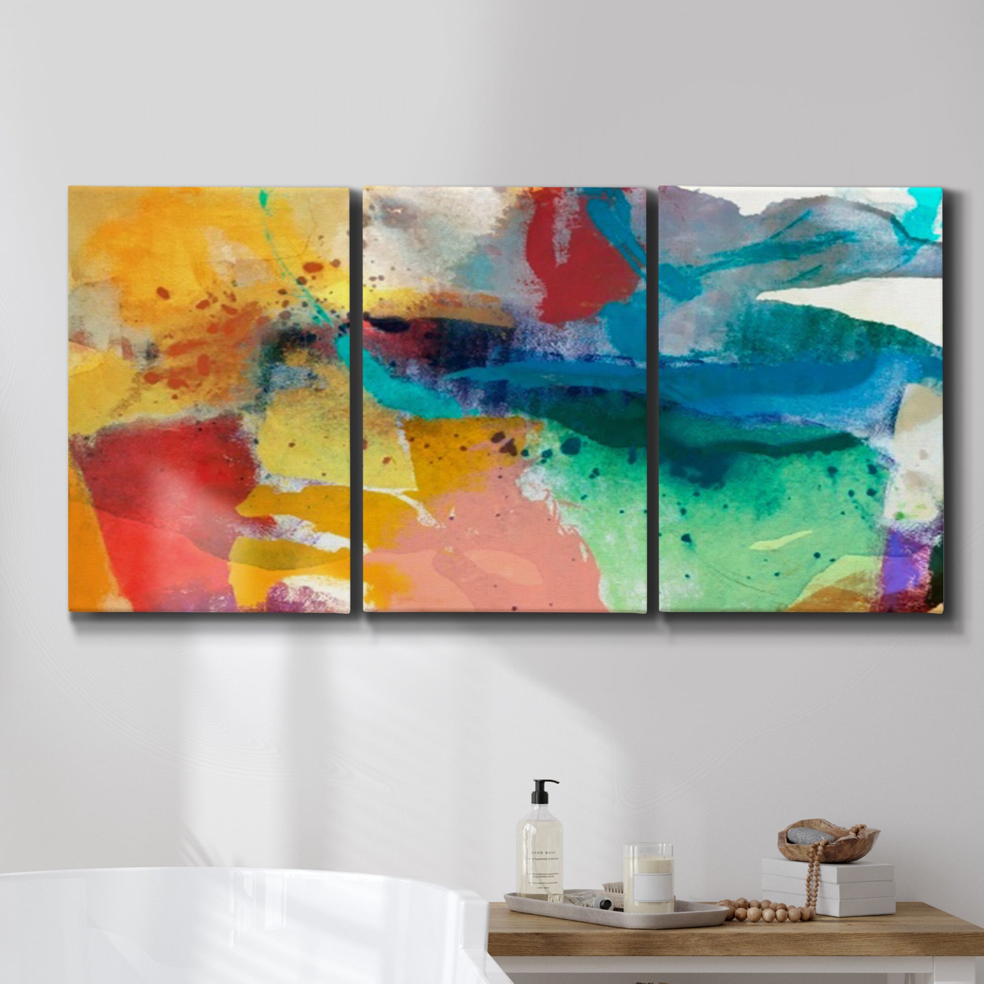 Three-panel canvas wall art featuring layered abstract observational color blocks, displayed in a bathroom above a bathtub.