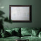 Impressionist atmospheric landscape in morning haze by Claude Monet in an ornate black frame with gilded inner detail displayed in a dark-toned interior setting.