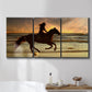 Three-panel canvas wall art featuring running horse along beach photograph, displayed in a bathroom above a bathtub.