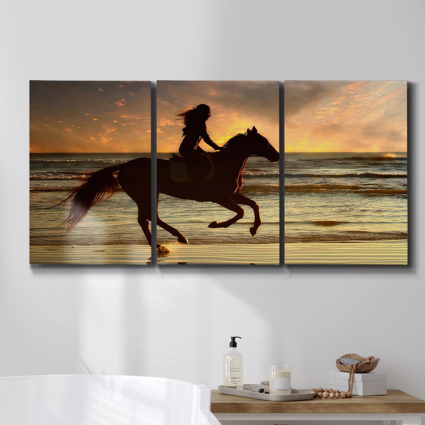 Three-panel canvas wall art featuring running horse along beach photograph, displayed in a bathroom above a bathtub.
