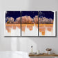 Three-panel canvas wall art featuring panoramic treeline landscape photograph, displayed in a bathroom above a bathtub.