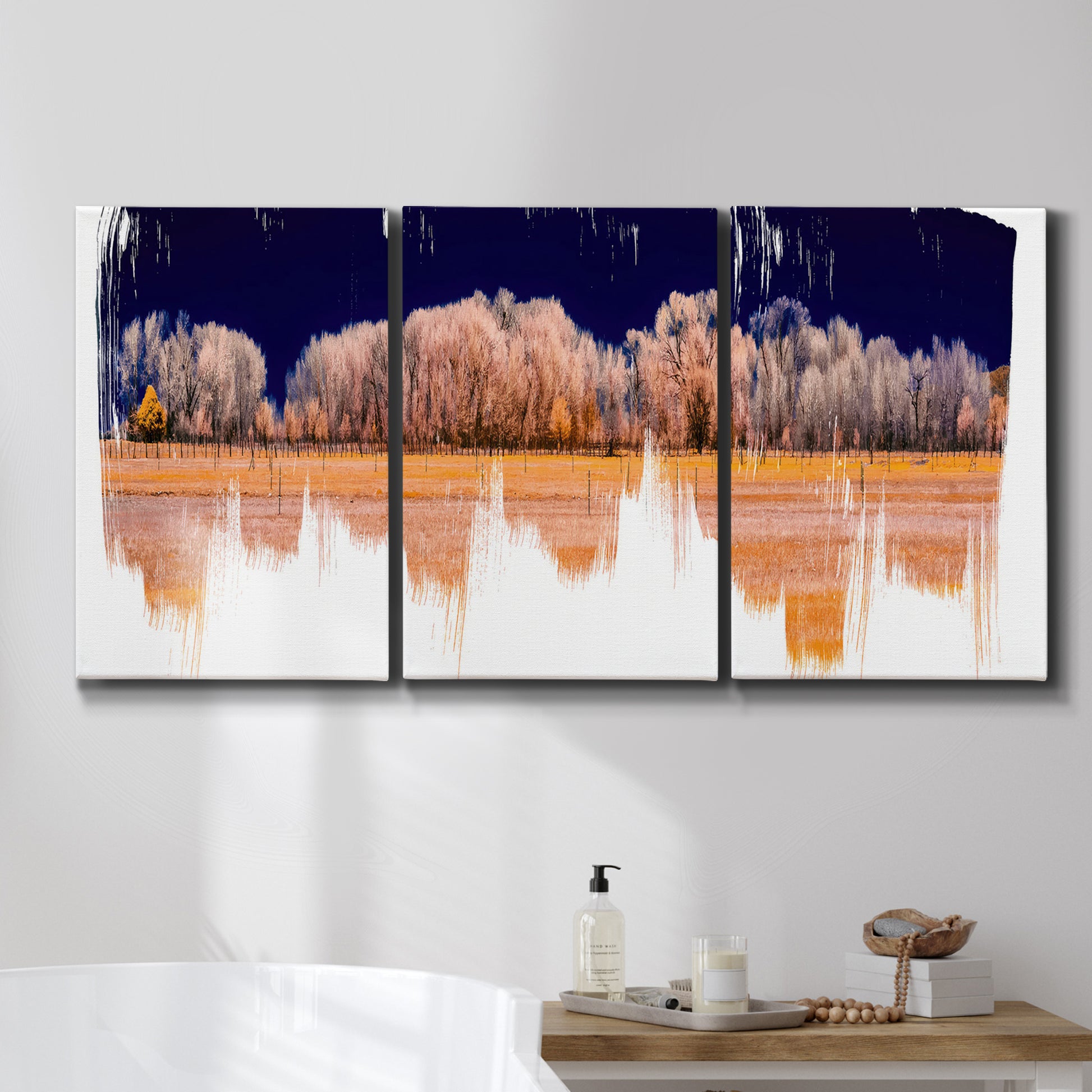 Three-panel canvas wall art featuring panoramic treeline landscape photograph, displayed in a bathroom above a bathtub.