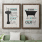 Set of two walnut barnwood framed canvas prints depicting a coordinated art pair of playful bathtub silhouettes and bath-themed typography rendered as graphic bathroom word art above a sofa in a modern living room.