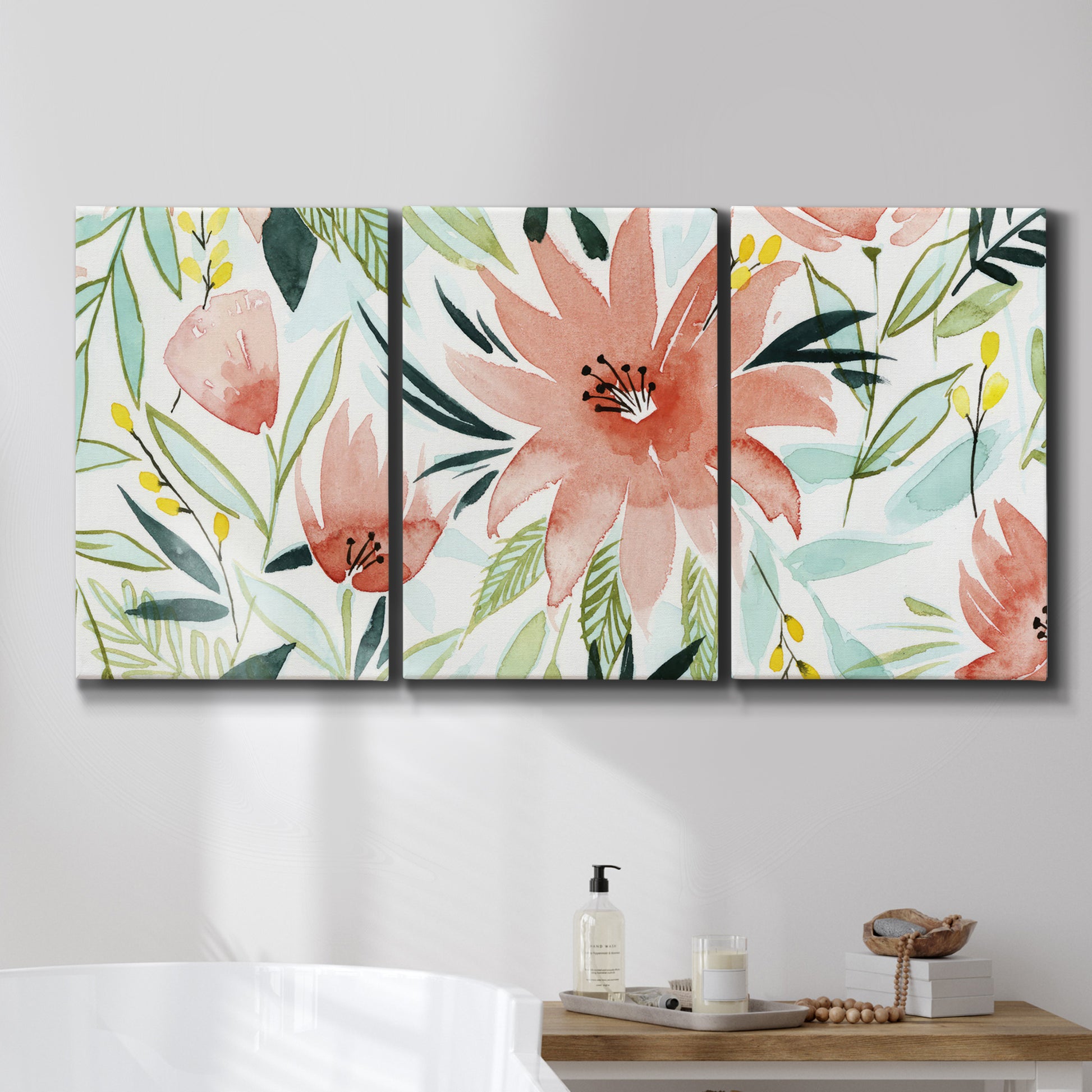 Three-panel canvas wall art featuring tropical botanical collage, displayed in a bathroom above a bathtub.