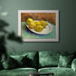Impressionist still life with lemons by Vincent van Gogh in an ornate weathered white frame displayed in a dark-toned interior setting.