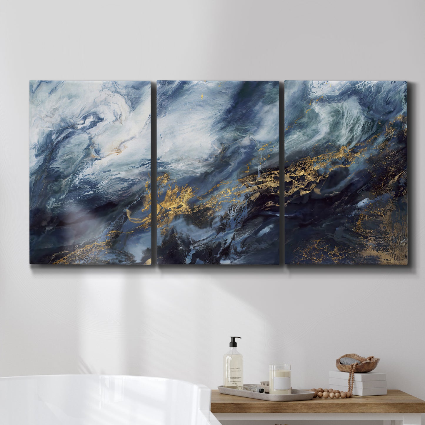 Three-panel canvas wall art featuring soft abstract landscape anticipation tones, displayed in a bathroom above a bathtub.