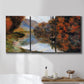 Three-panel canvas wall art featuring rowboat on quiet river bend, displayed in a bathroom above a bathtub.