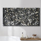 Three-panel canvas wall art featuring energetic expressionist abstract splatter, displayed in a bathroom above a bathtub.