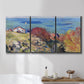 Three-panel canvas wall art featuring coastal village shoreline landscape, displayed in a bathroom above a bathtub.