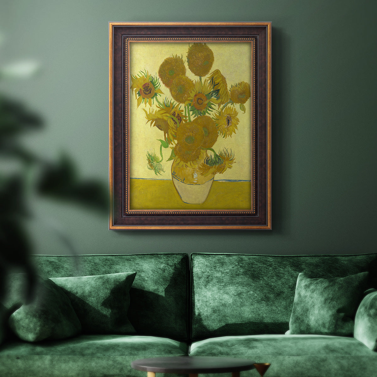 Impressionist sunflower still life painting by Vincent van Gogh in an ornate bronzed mahogany wood frame displayed in a dark-toned interior setting.
