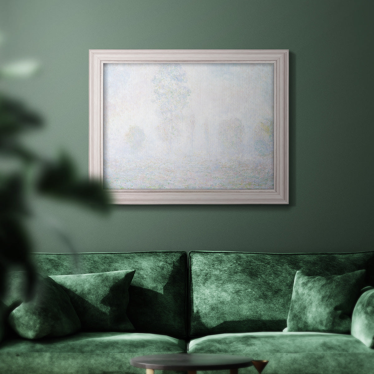 Impressionist atmospheric landscape in morning haze by Claude Monet in an ornate weathered white frame displayed in a dark-toned interior setting.