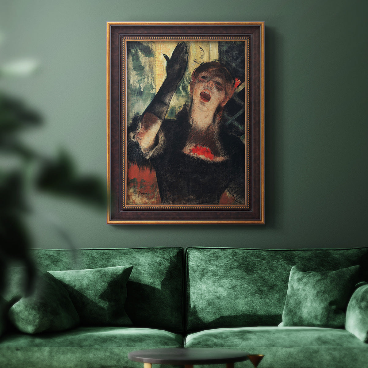 Impressionist portrait of a café singer by Edgar Degas in an ornate bronzed mahogany wood frame displayed in a dark-toned interior setting.