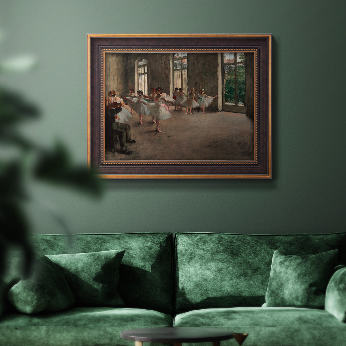 Early impressionist ballet rehearsal painting by Edgar Degas in an ornate bronzed mahogany wood frame displayed in a dark-toned interior setting.