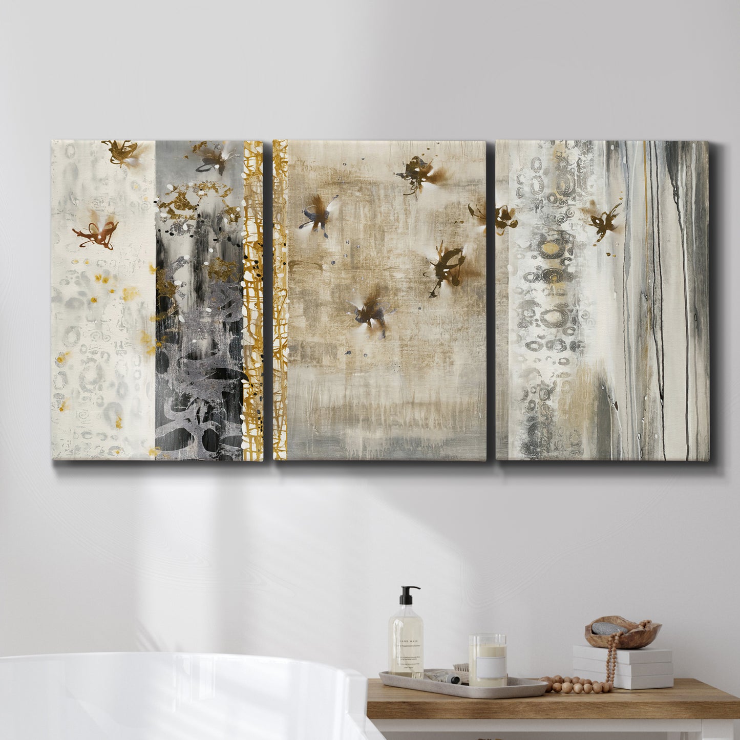 Three-panel canvas wall art featuring abstract willow inspired vertical forms, displayed in a bathroom above a bathtub.