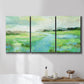Three-panel canvas wall art featuring gentle stream winding through trees, displayed in a bathroom above a bathtub.