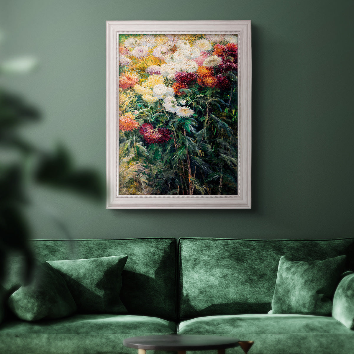 Impressionist garden floral painting by Gustave Caillebotte in an ornate weathered white frame displayed in a dark-toned interior setting.