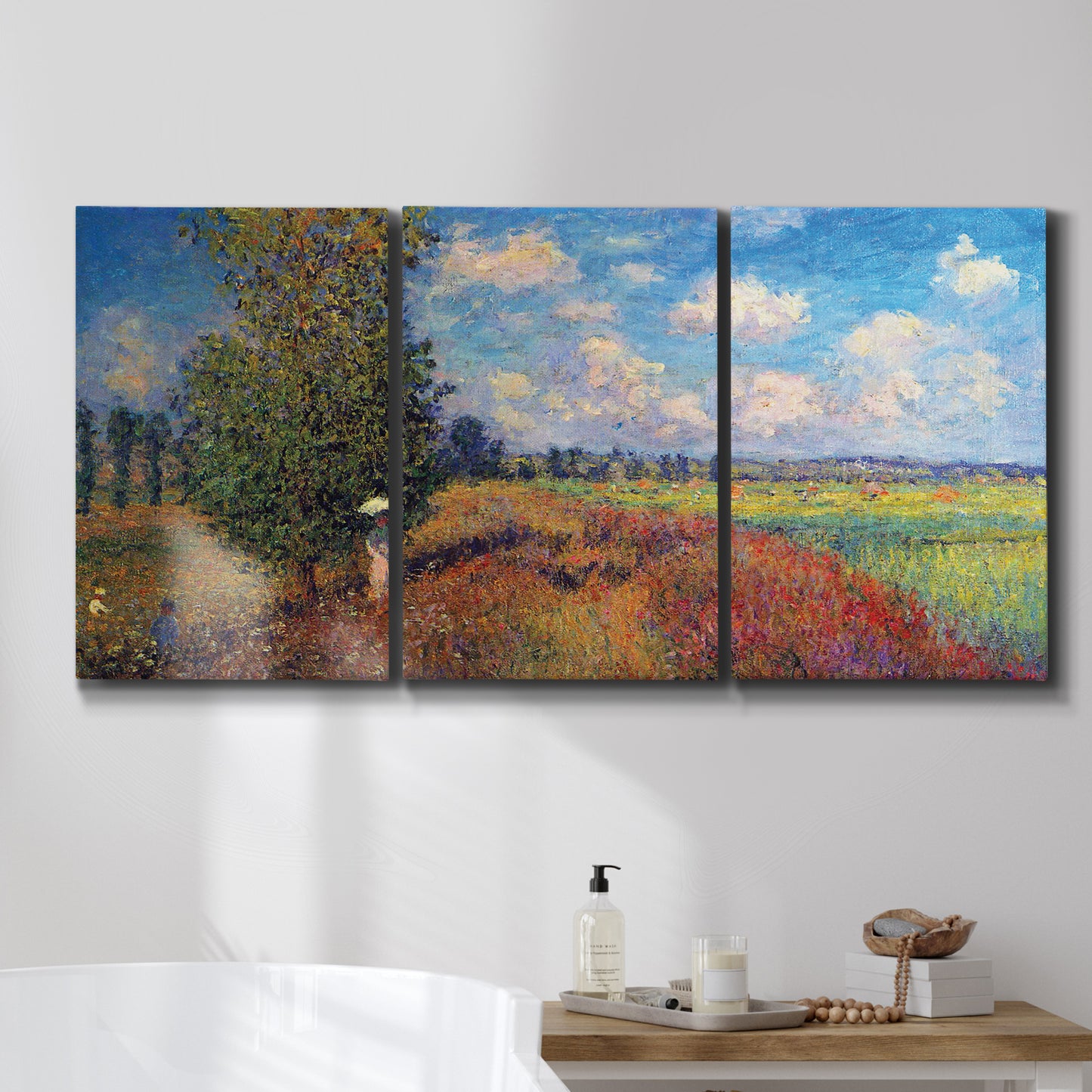 Three-panel canvas wall art featuring summer poppy field in bloom, displayed in a bathroom above a bathtub.