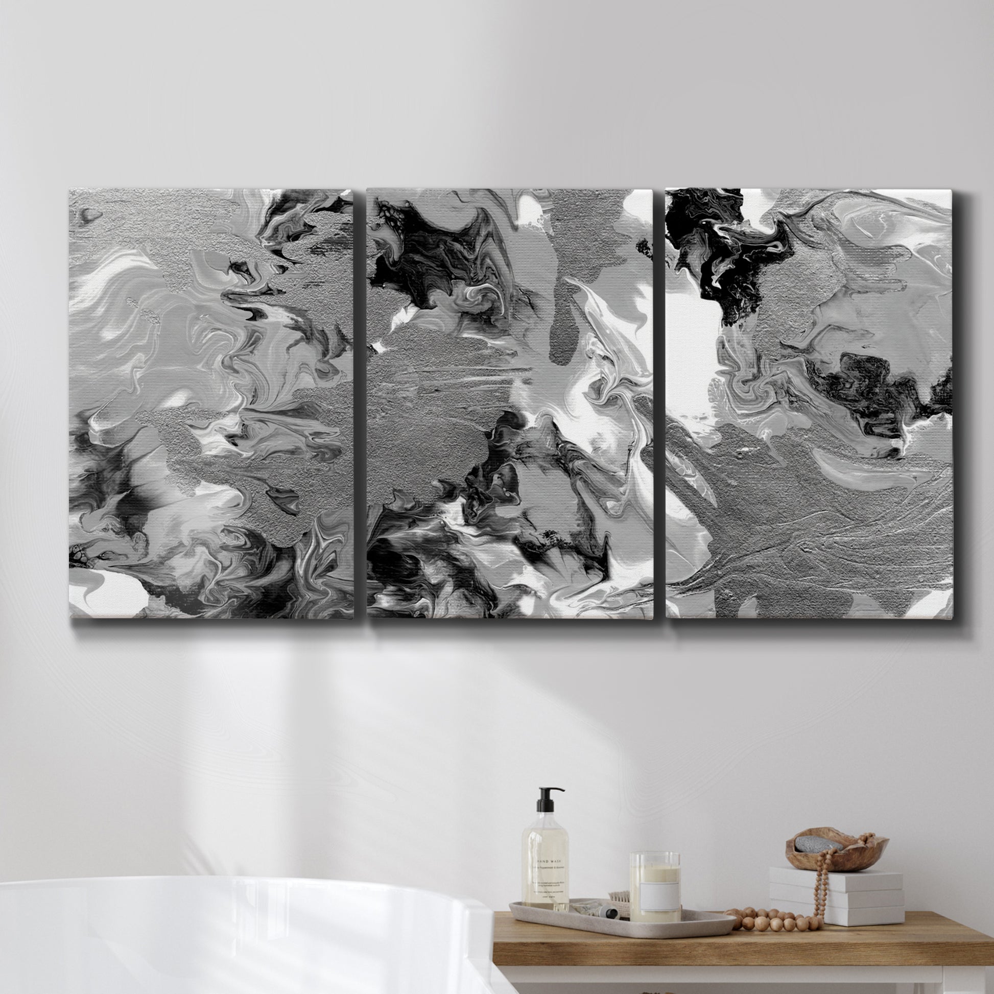 Three-panel canvas wall art featuring abstract marble texture composition, displayed in a bathroom above a bathtub.