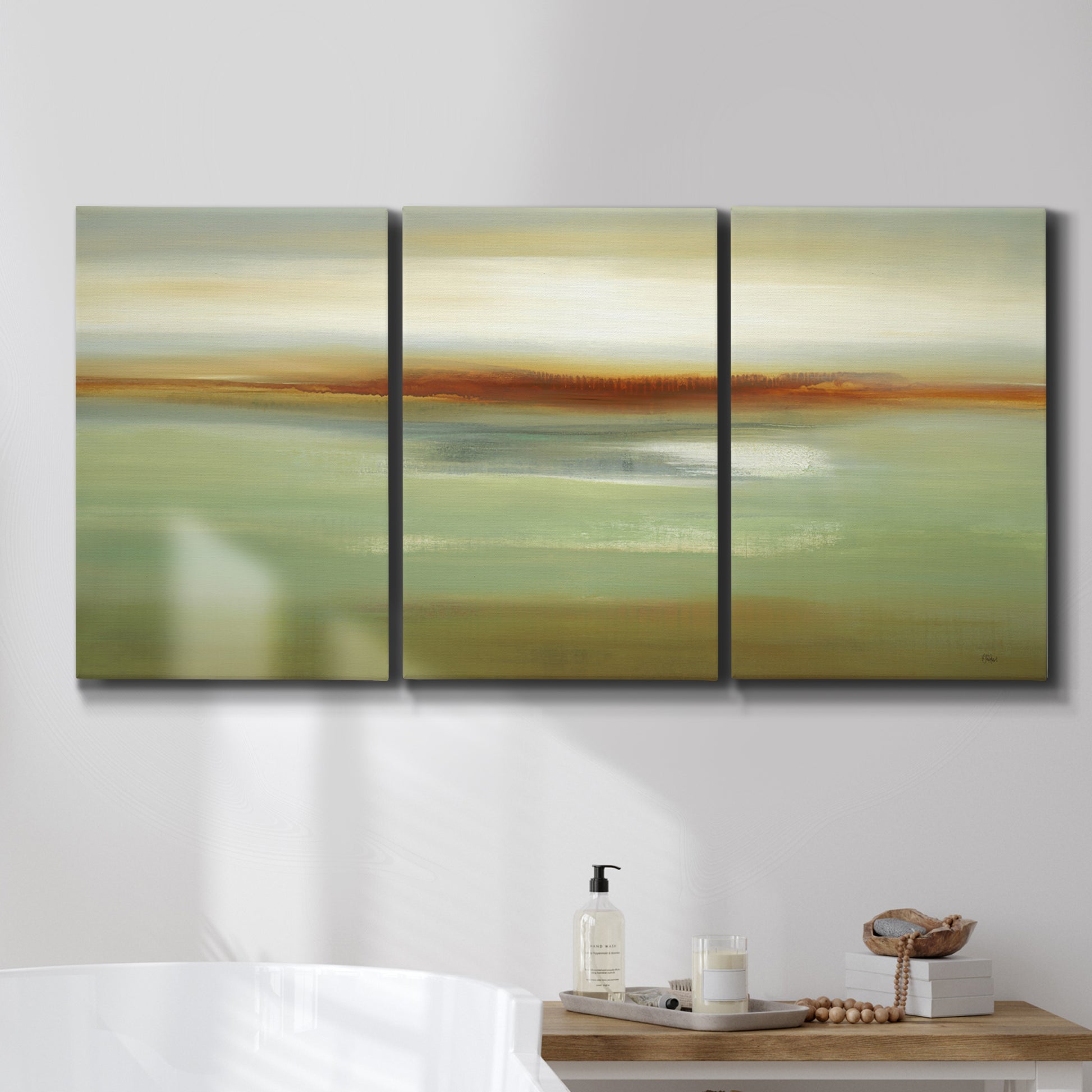 Three-panel canvas wall art featuring green focused abstract color vision, displayed in a bathroom above a bathtub.