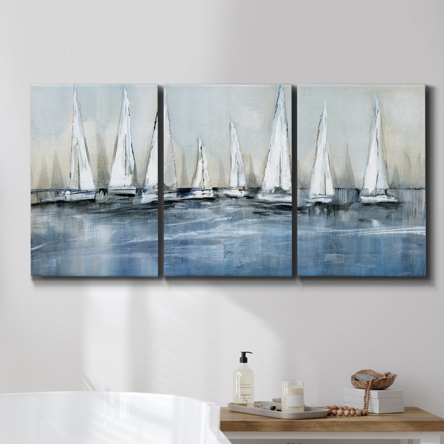 Three-panel canvas wall art featuring still life with pears and grapes, displayed in a bathroom above a bathtub.