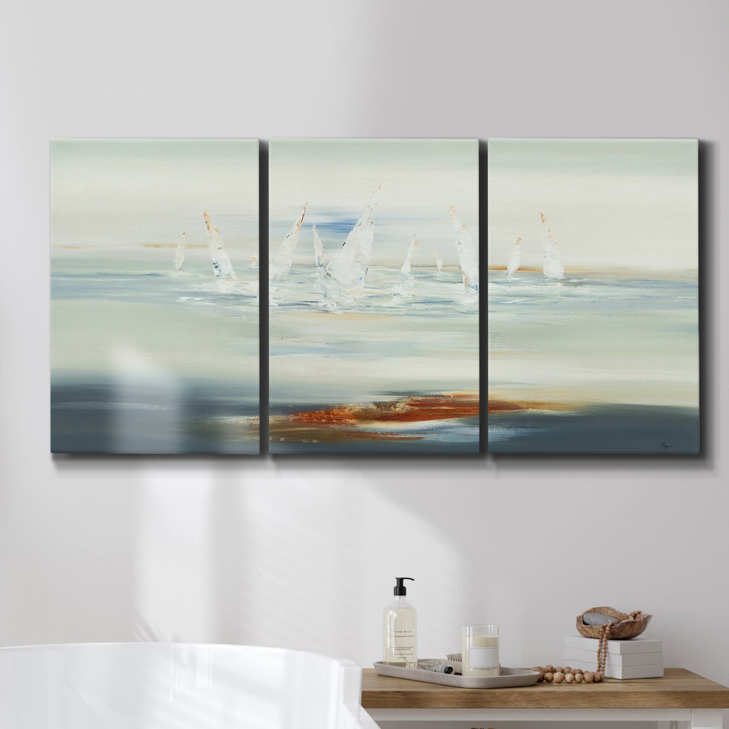 Three-panel canvas wall art featuring nautical abstract suggesting drifting calm, displayed in a bathroom above a bathtub.