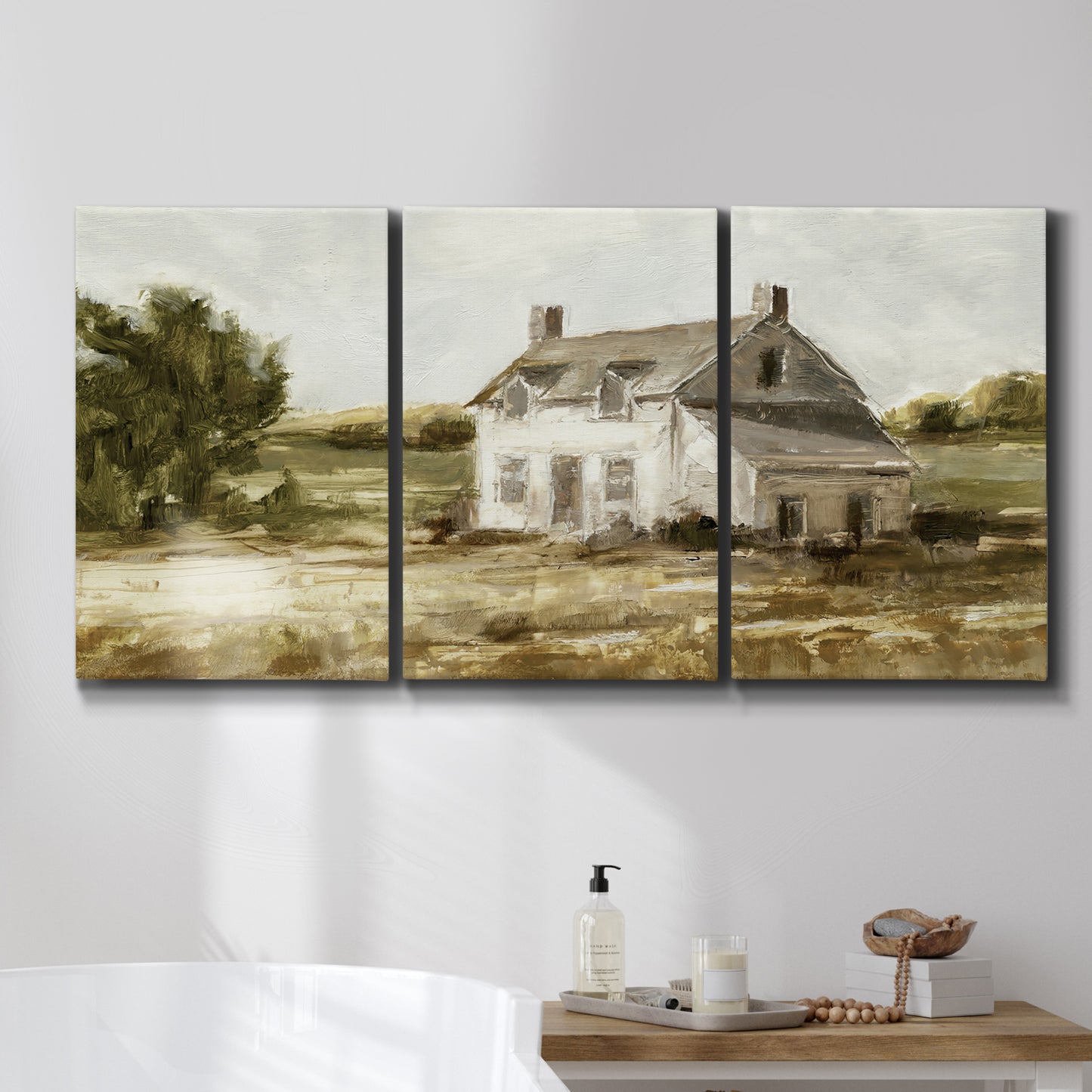 Three-panel canvas wall art featuring rural farmhouse harvest landscape, displayed in a bathroom above a bathtub.