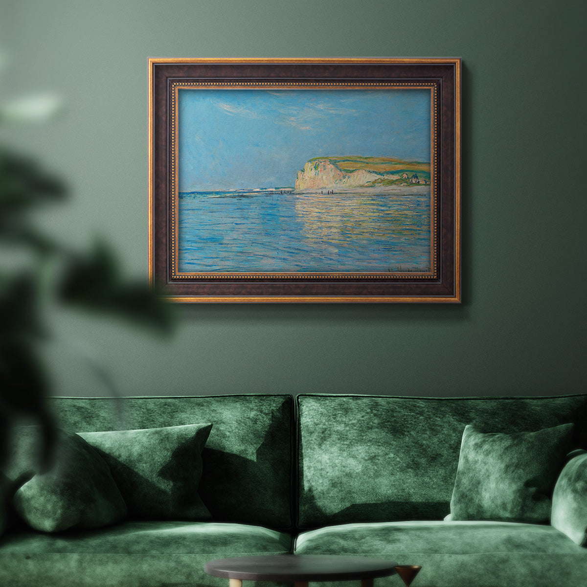 Impressionist coastal low-tide seascape at Pourville by Claude Monet in an ornate bronzed mahogany wood frame displayed in a dark-toned interior setting.