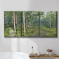 Three-panel canvas wall art featuring woodland forest scene with tall trees, displayed in a bathroom above a bathtub.