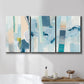 Three-panel canvas wall art featuring layered geometric abstract strata forms, displayed in a bathroom above a bathtub.