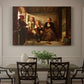 Canvas art print featuring a group of rural villagers gathered inside a dimly lit wooden interior in conversation, showcased as a statement wall artwork