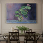Canvas art print featuring a potted geranium with green leaves and blossoms against a dark background, showcased as a statement wall artwork