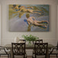 Canvas art print featuring young boys running and playing along shoreline in sunlight, showcased as a statement wall artwork
