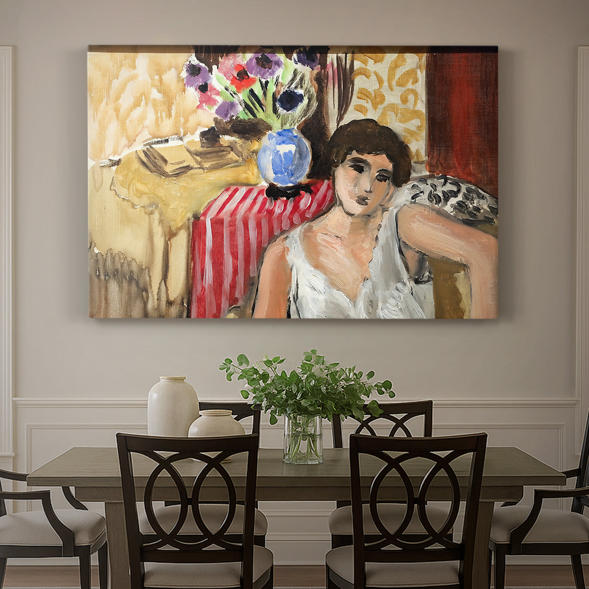 Canvas art print featuring a seated woman in an armchair in a colorful interior, showcased as a statement wall artwork