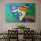 Canvas art print featuring a colorful geometric cat face with angular shapes, showcased as a statement wall artwork