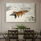 Canvas art print featuring a fox running across snowy landscape with sparse vegetation, showcased as a statement wall artwork