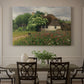 Canvas art print featuring a farmhouse surrounded by meadow filled with wildflowers and greenery, showcased as a statement wall artwork