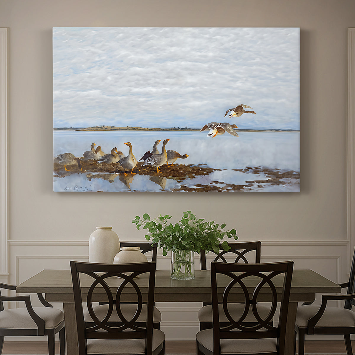 Canvas art print featuring a group of geese gathered near water in a natural wetland landscape, showcased as a statement wall artwork