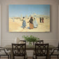 Canvas art print featuring figures traveling across desert with distant city and tombs on horizon, showcased as a statement wall artwork