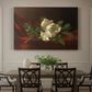 Canvas art print featuring a white magnolia bloom resting on red velvet surface, showcased as a statement wall artwork