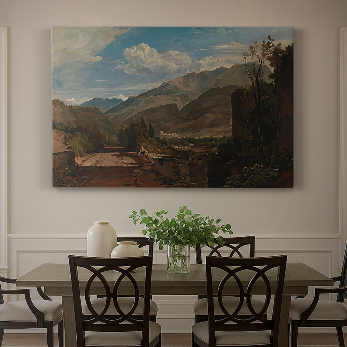 Canvas art print featuring a mountain landscape with town and river under dramatic sky, showcased as a statement wall artwork