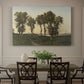 Canvas art print featuring trees silhouetted against evening sky in warm autumn tones, showcased as a statement wall artwork