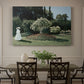 Canvas art print featuring a woman standing in garden surrounded by flowers and greenery, showcased as a statement wall artwork